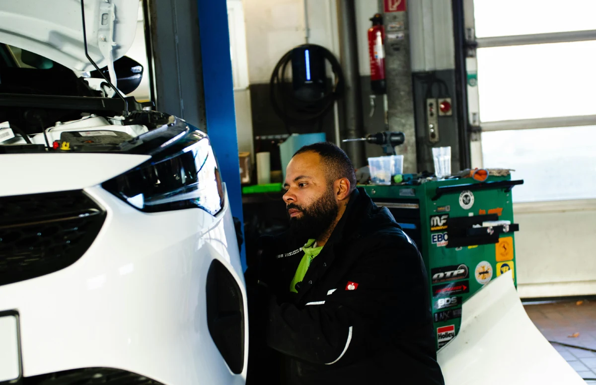 mechanic maintaining car